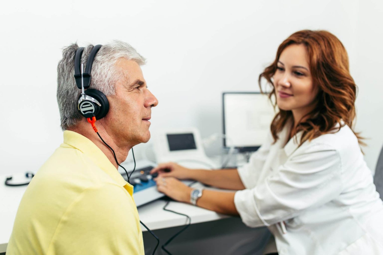 Man gets a hearing test.