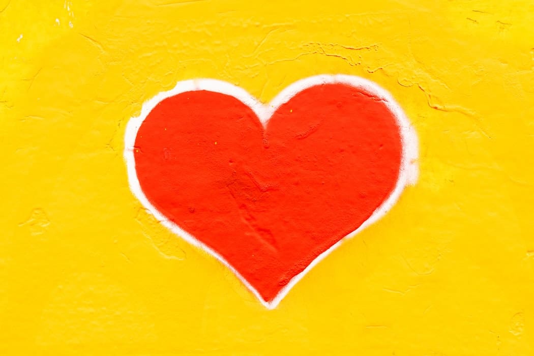 Picture of a heart on a yellow background.