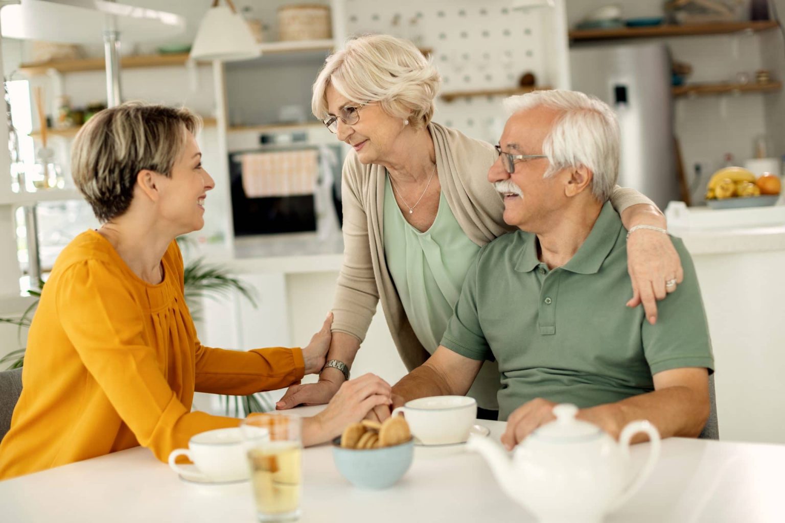 Adult daughter talking to her parents about their family history.