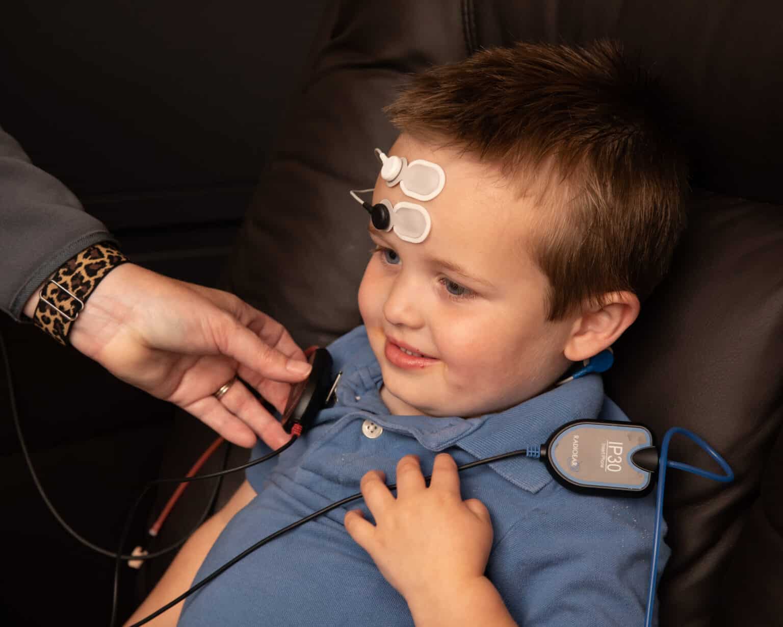 Child being fitted with an implantable hearing device