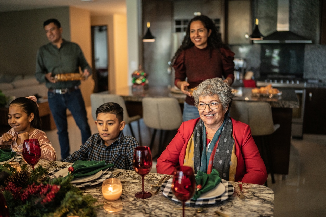 Family sitting down for a holiday dinner.