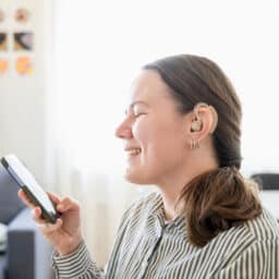 Happy woman with new hearing aids