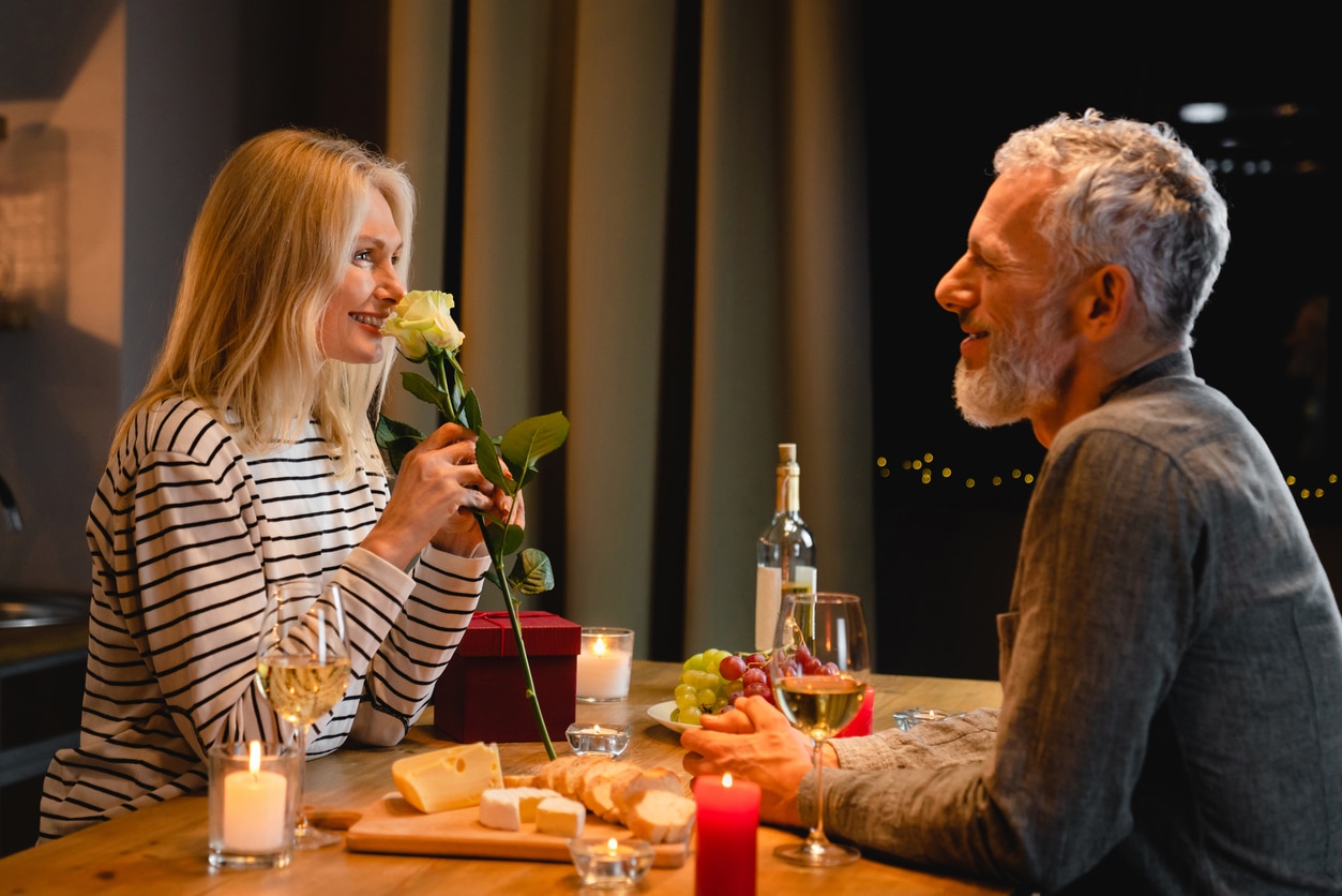 Happy couple celebrating valentine's day at home.